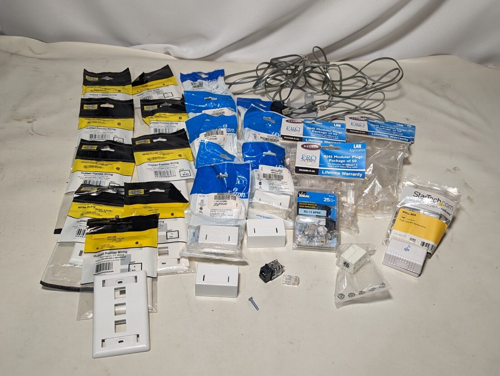 Lot of Belkin RJ45 modular plugs, Hubbell INFINe plates, Leviton quickports,more